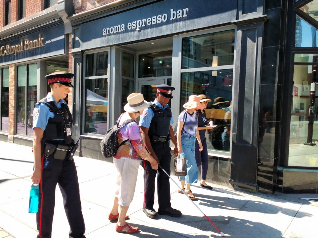 White cane demonstration with police officers